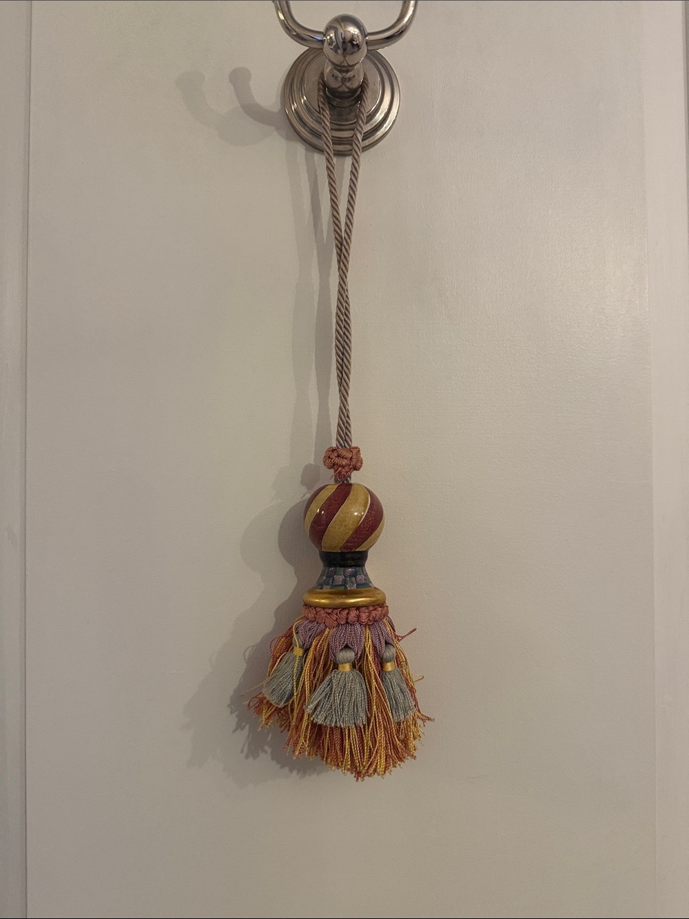 Decorative Tassel in Gold, Burgundy, and Pink